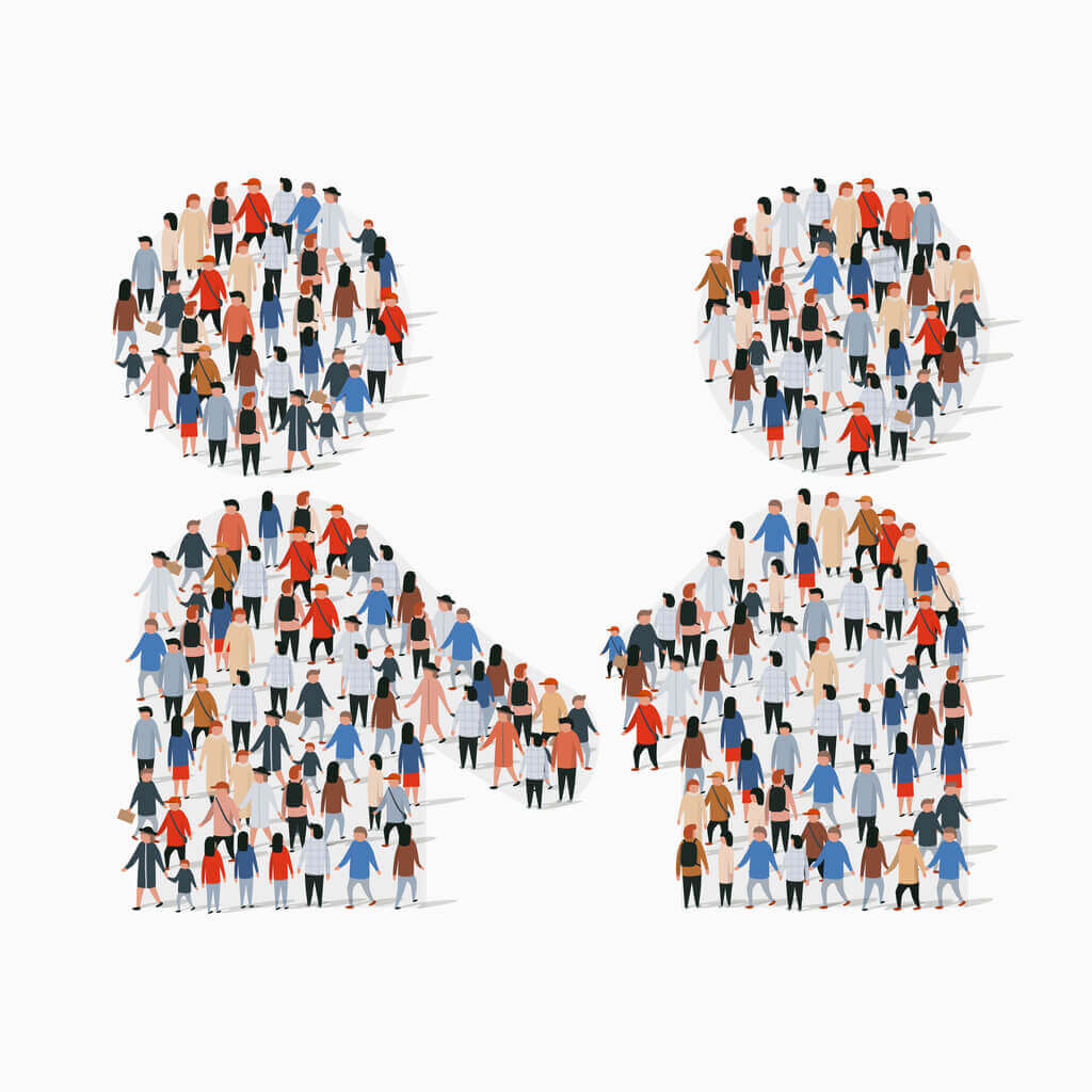 Image of people standing in the shape of two people facing towards each other
